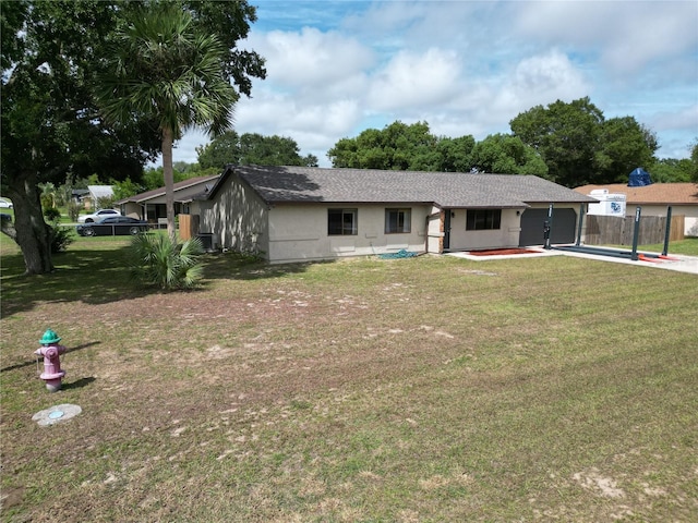 ranch-style home featuring a front yard