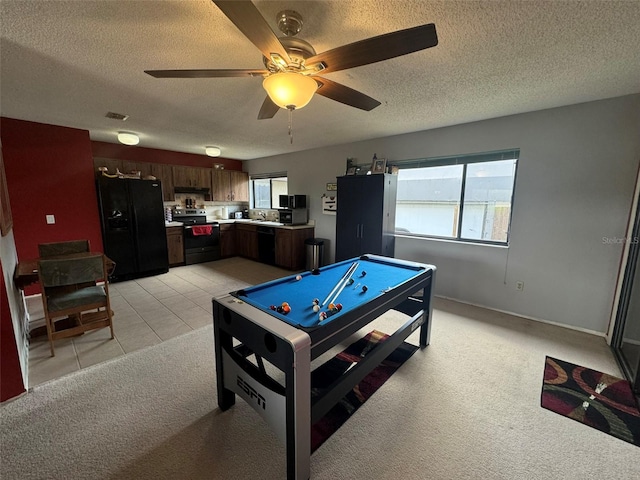 recreation room with light carpet, a textured ceiling, billiards, and ceiling fan