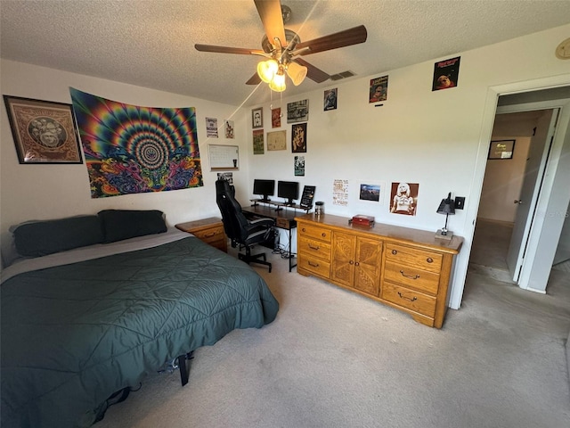 carpeted bedroom with a textured ceiling, ceiling fan, and lofted ceiling