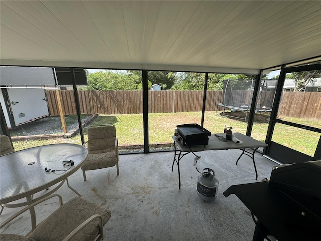 sunroom / solarium featuring wood ceiling