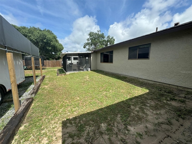 view of yard featuring a sunroom