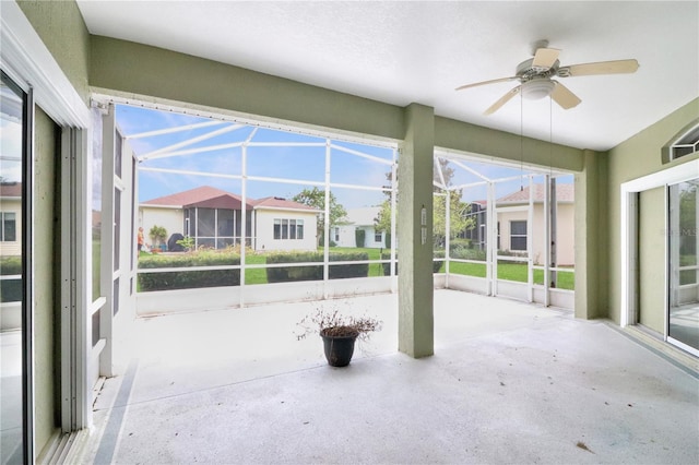 exterior space with ceiling fan and a lanai