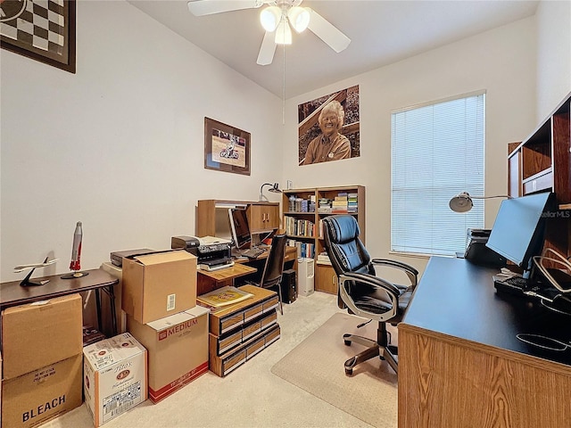 carpeted office with ceiling fan