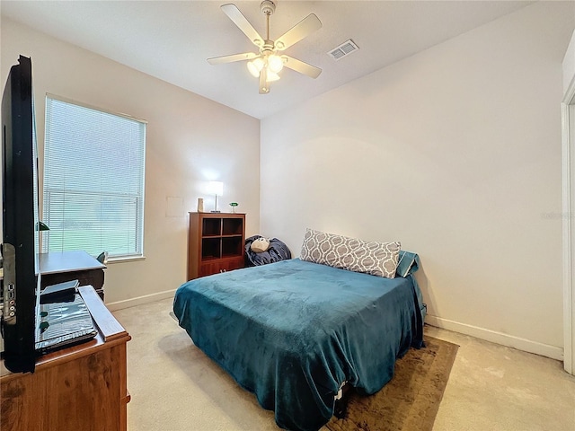 bedroom with light colored carpet and ceiling fan