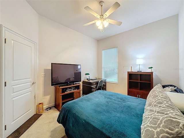 bedroom with ceiling fan and carpet