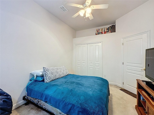 bedroom featuring a closet, carpet flooring, and ceiling fan