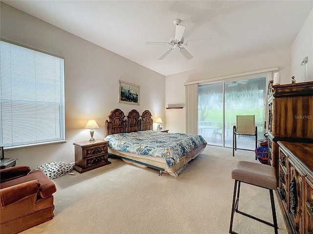 bedroom featuring ceiling fan, access to exterior, and carpet floors