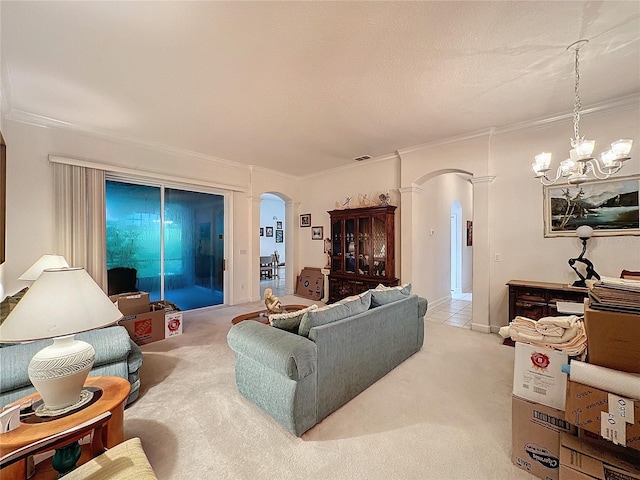 living room featuring a chandelier, light colored carpet, and crown molding