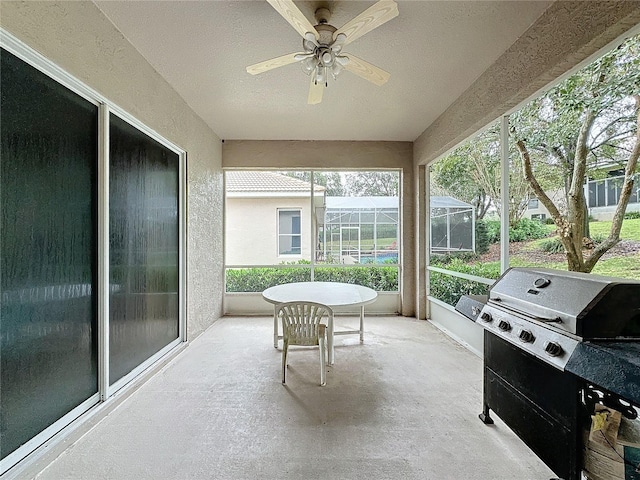 sunroom / solarium with ceiling fan