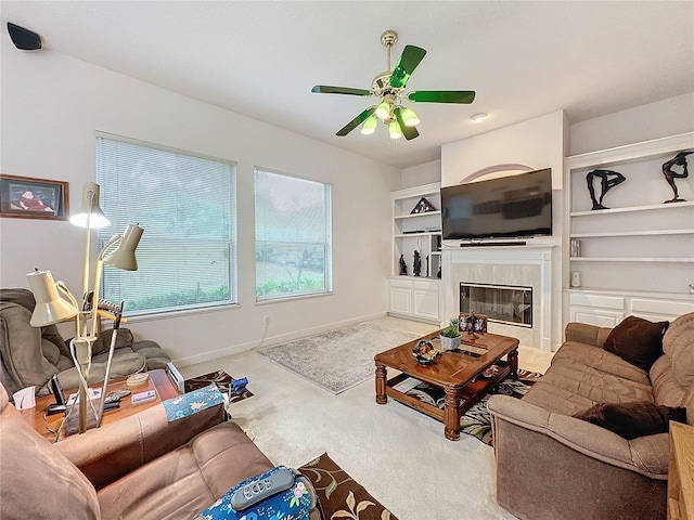 carpeted living room with ceiling fan