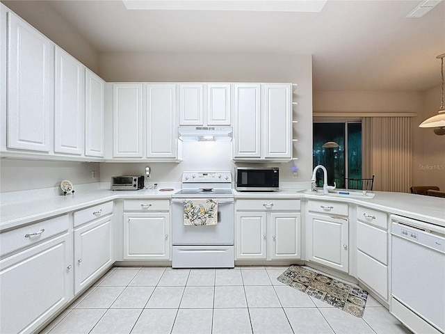 kitchen with white cabinets, white appliances, sink, and hanging light fixtures