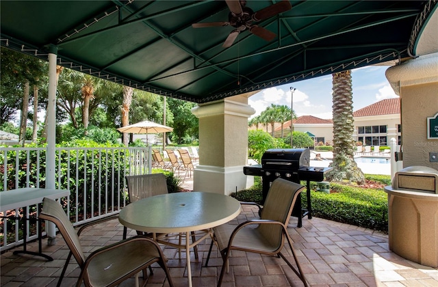 view of patio / terrace featuring ceiling fan and a grill