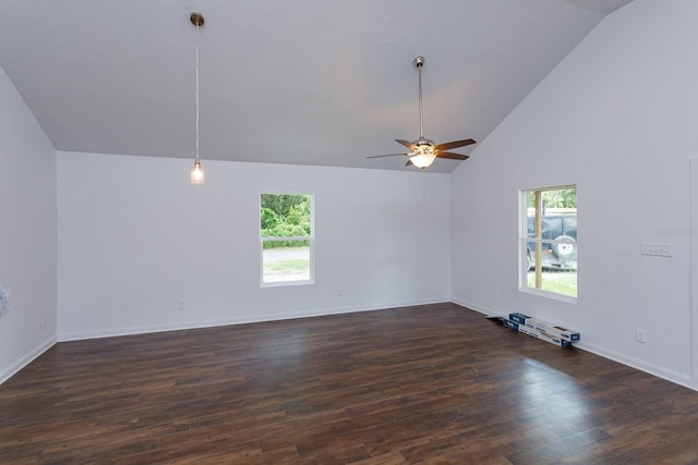 spare room featuring ceiling fan, dark hardwood / wood-style floors, and high vaulted ceiling