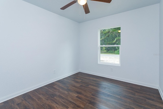 spare room with ceiling fan and dark hardwood / wood-style floors