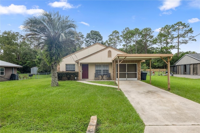 view of front facade with a front lawn and a carport