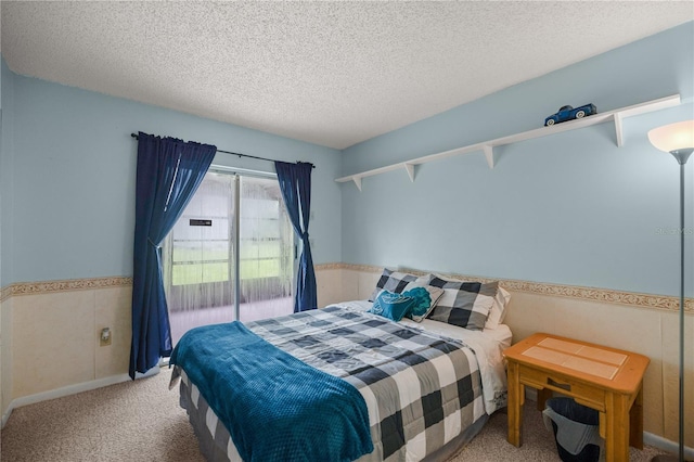 carpeted bedroom featuring a textured ceiling