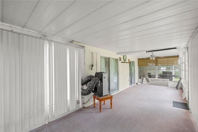 sunroom featuring ceiling fan