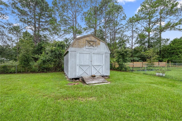 view of outbuilding with a lawn