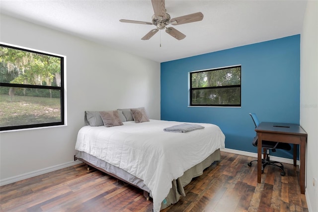 bedroom featuring ceiling fan and dark hardwood / wood-style flooring