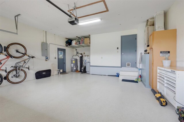 garage featuring electric panel, a garage door opener, and water heater