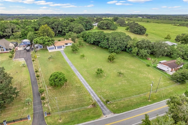 birds eye view of property with a rural view