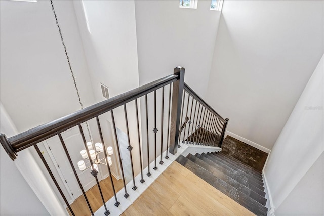 15607 Vetta Dr, Montverde, FL 34756 - stairway featuring wood finished floors and visible vents