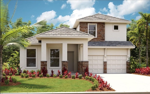 view of front facade featuring a garage and a front lawn