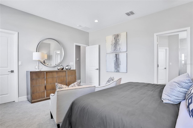 bedroom featuring light colored carpet