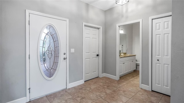 entryway featuring light tile patterned flooring