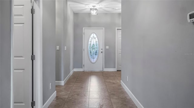 entryway with light tile patterned floors