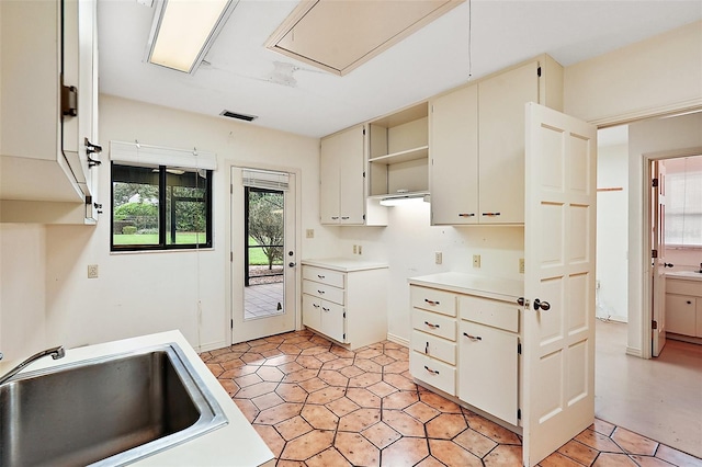 kitchen with white cabinets and sink