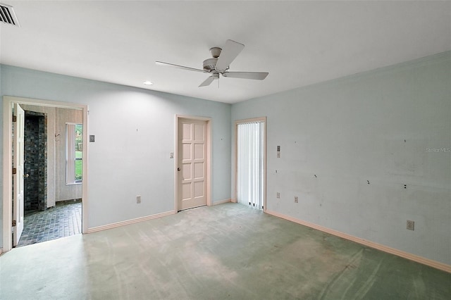 empty room featuring ceiling fan and carpet flooring