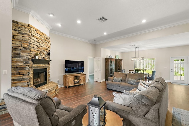 living room with a fireplace, dark hardwood / wood-style floors, and ornamental molding