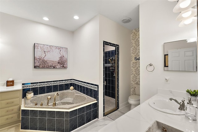 full bathroom featuring separate shower and tub, toilet, and vanity