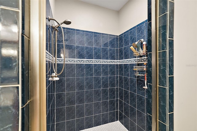 bathroom with a tile shower