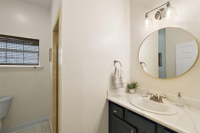 bathroom featuring a shower with shower door, toilet, and vanity