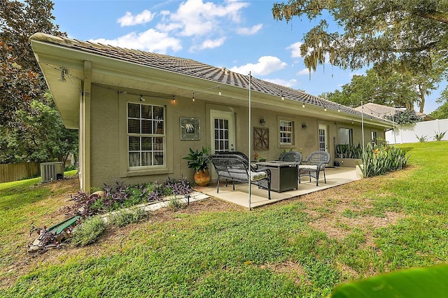 back of property featuring a patio area and a yard