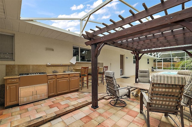 view of patio featuring a wet bar, area for grilling, glass enclosure, and a pergola