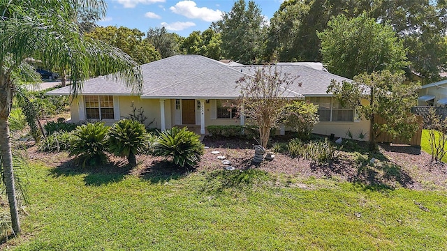 single story home with a front lawn