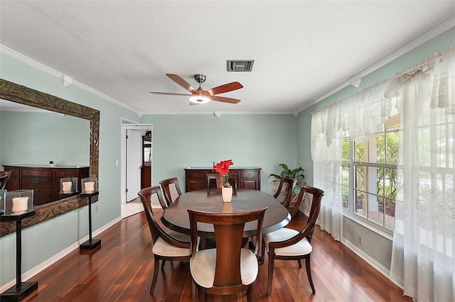 dining space with crown molding, dark hardwood / wood-style floors, and ceiling fan