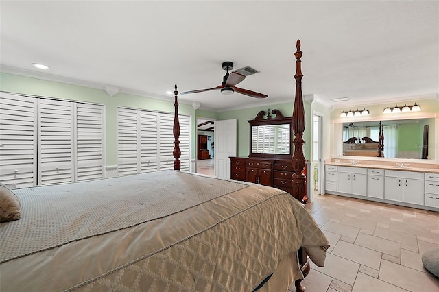 bedroom with ensuite bathroom, ornamental molding, and ceiling fan