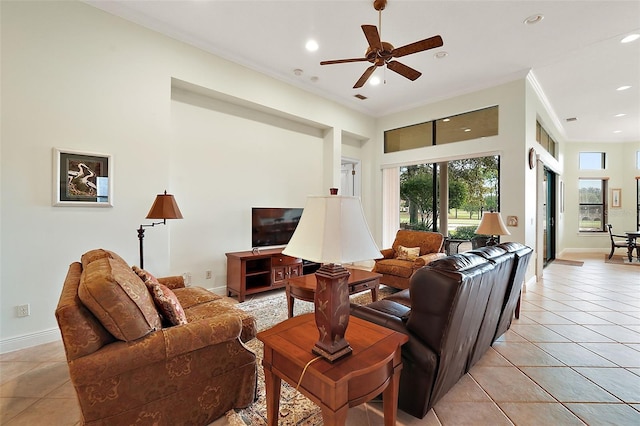 tiled living room featuring ceiling fan and ornamental molding