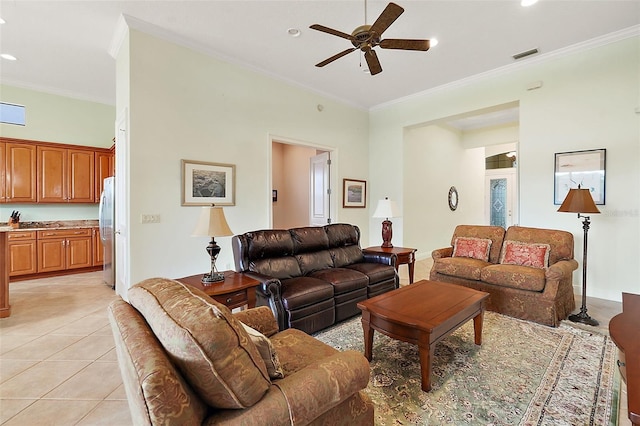 tiled living room featuring crown molding and ceiling fan