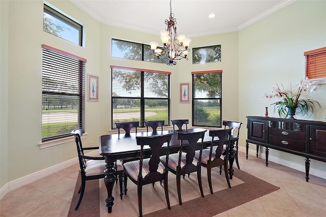 tiled dining area featuring a wealth of natural light, crown molding, and a chandelier