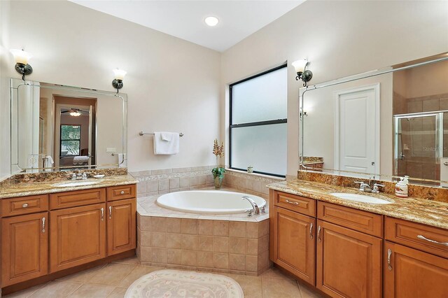 bathroom featuring vanity, tile patterned floors, and shower with separate bathtub