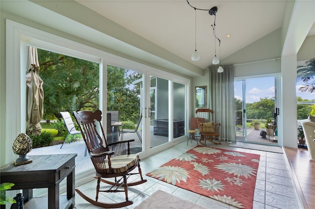 sunroom / solarium featuring vaulted ceiling