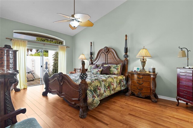 bedroom featuring light wood-type flooring, ceiling fan, access to outside, and vaulted ceiling