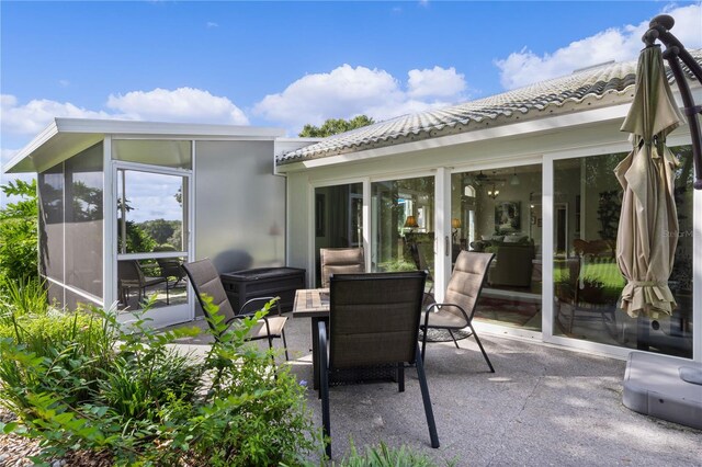 view of patio / terrace with a sunroom