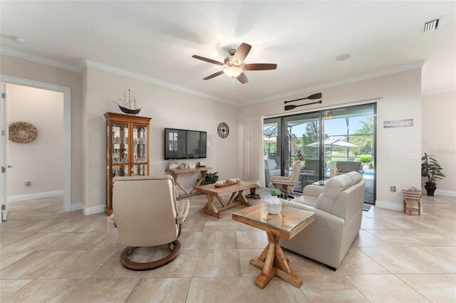 living room with a textured ceiling, ceiling fan, ornamental molding, and light tile patterned floors