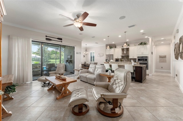 tiled living room with ornamental molding, a textured ceiling, and ceiling fan